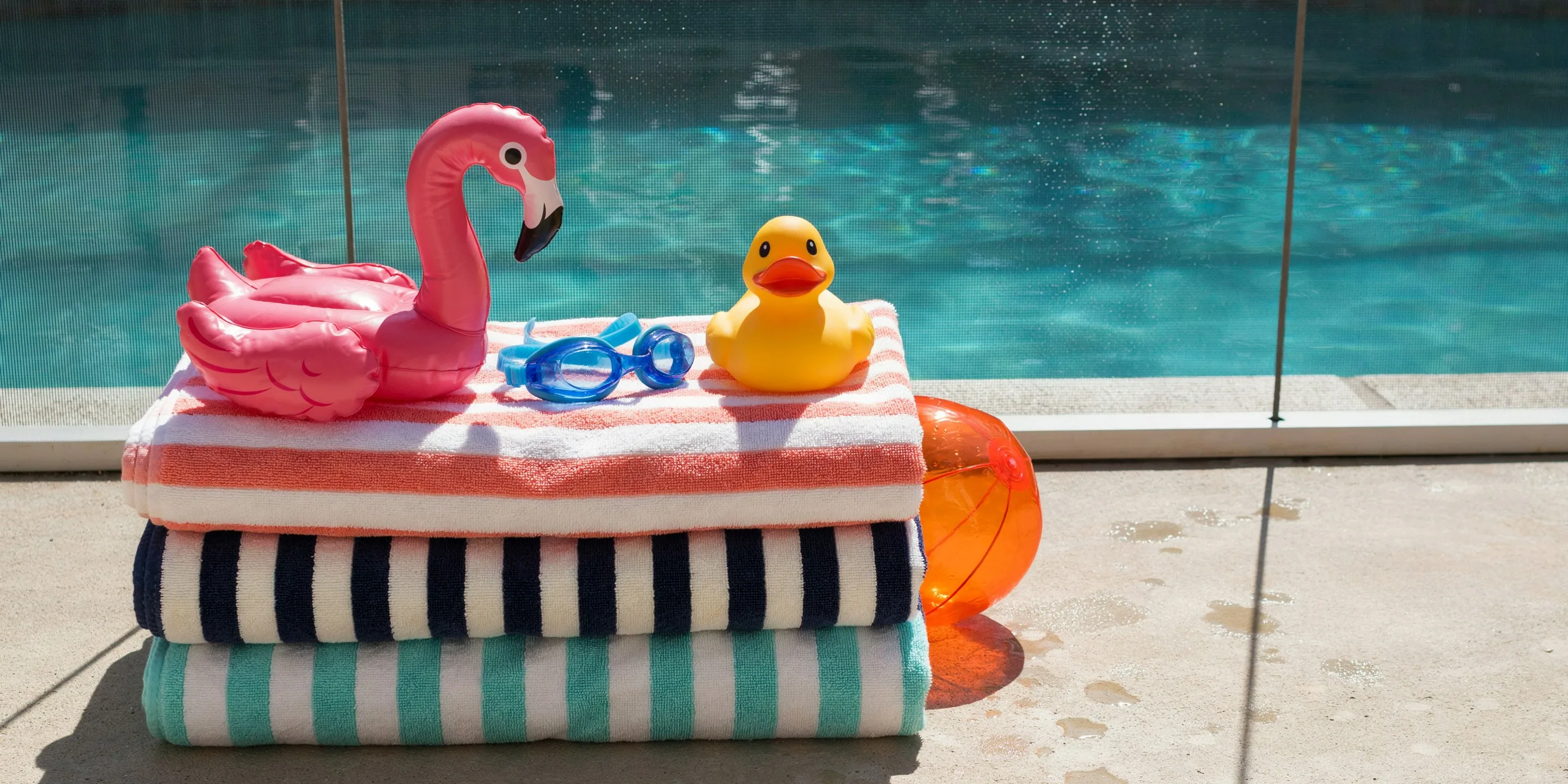 Pool deck inside a screened lanai in Buttonwood Harbor, Longboat Key, FL